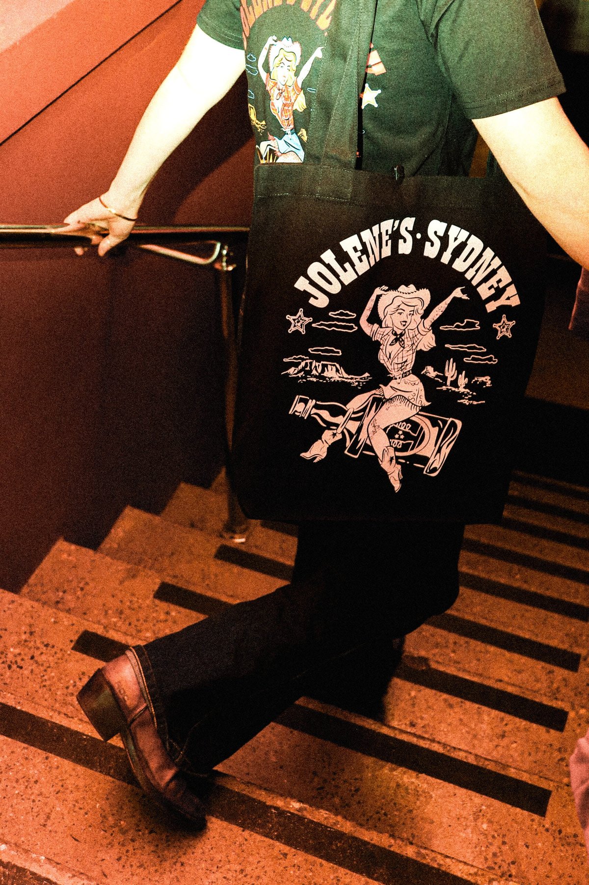 Jolenes dtf print by Melbourne Merch - Perfect lifestyle shot, dynamic angle, moody lighting, and the print is the clear focus