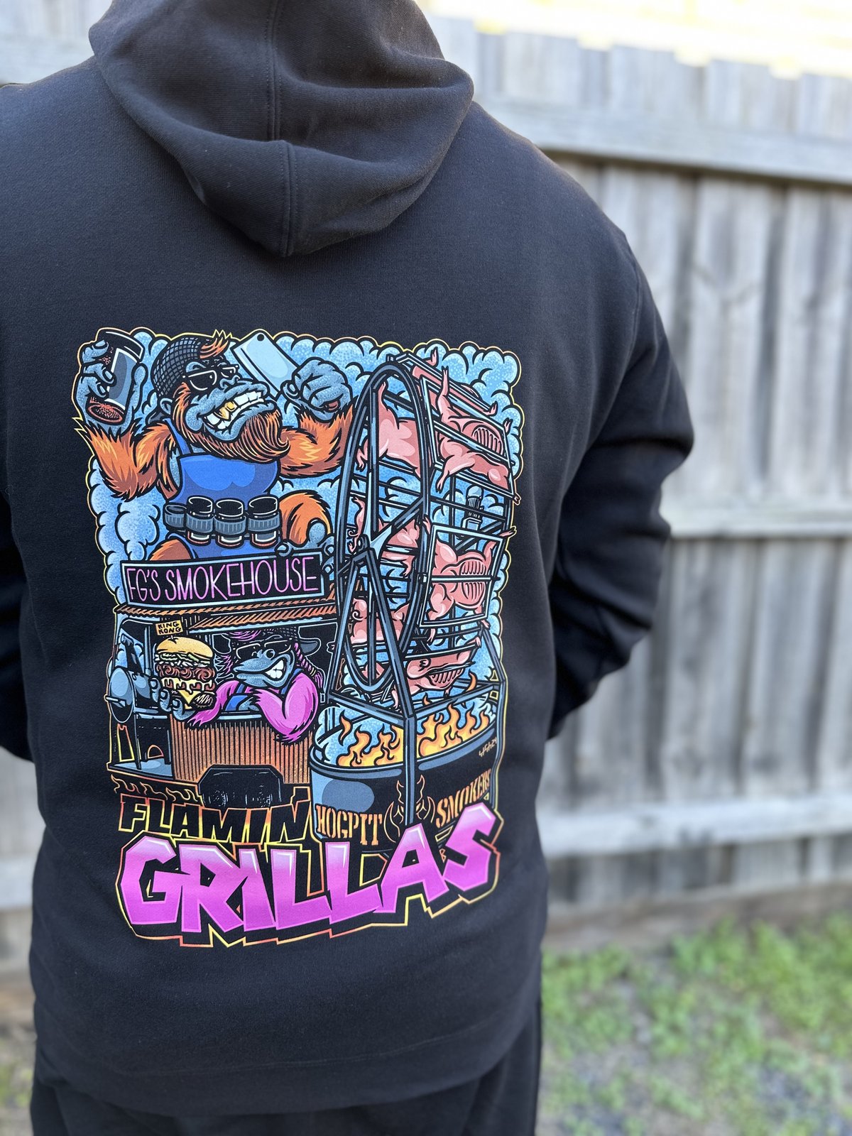 Flamin Grillas dtf print by Melbourne Merch - excellent lifestyle context worn outdoors, large back graphic is crisp and clearly the subject
