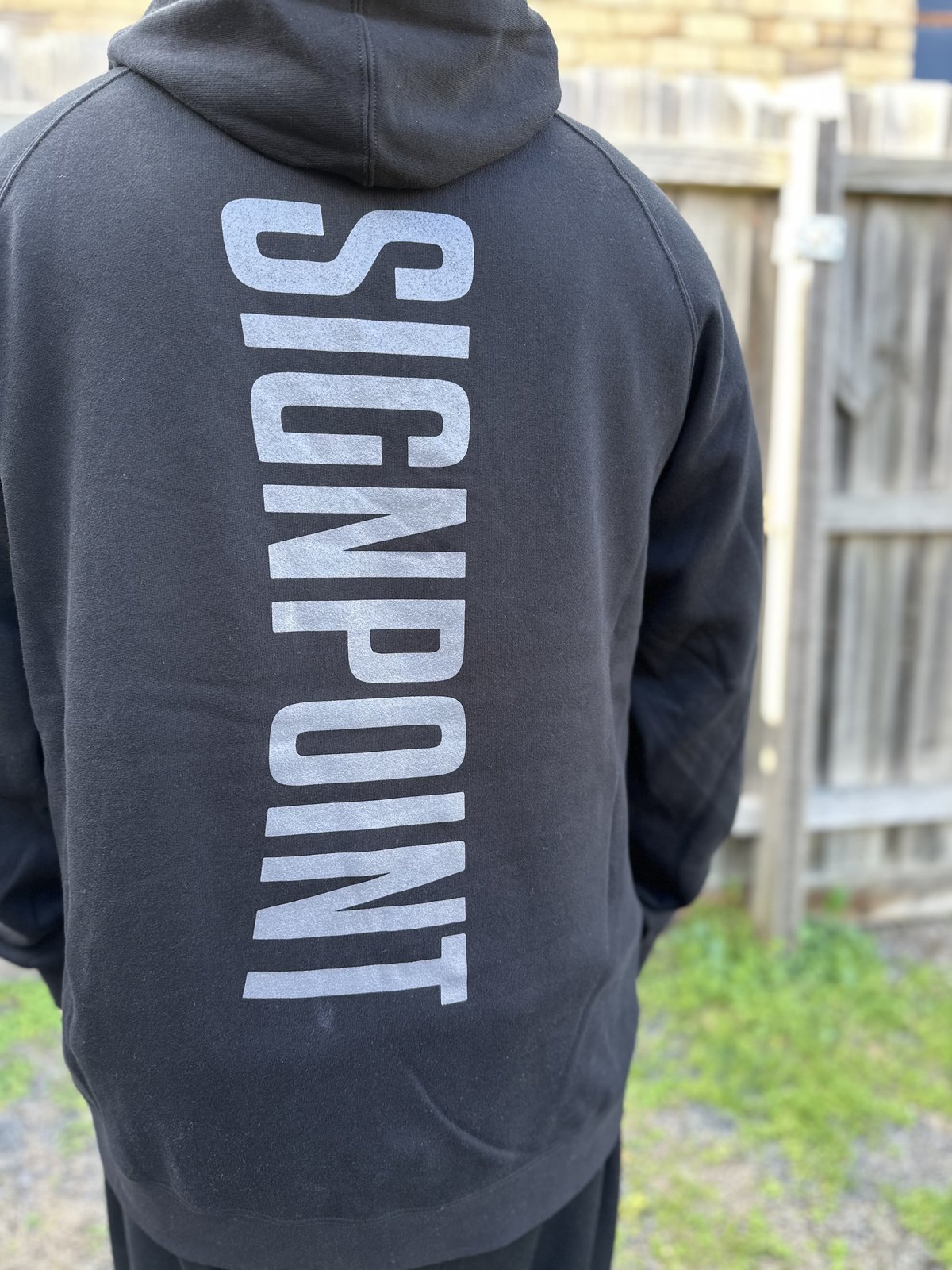 Signpoint screen print by Melbourne Merch - worn on person, striking print visibility, strong outdoor lifestyle composition