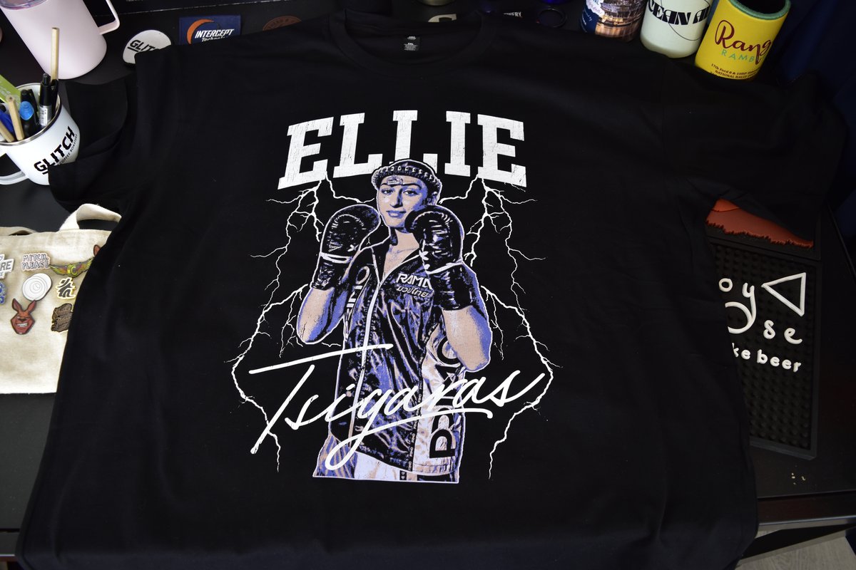 Custom dtf print by Melbourne Merch - crisp print, moody dark desk setting with lifestyle objects, professional composition