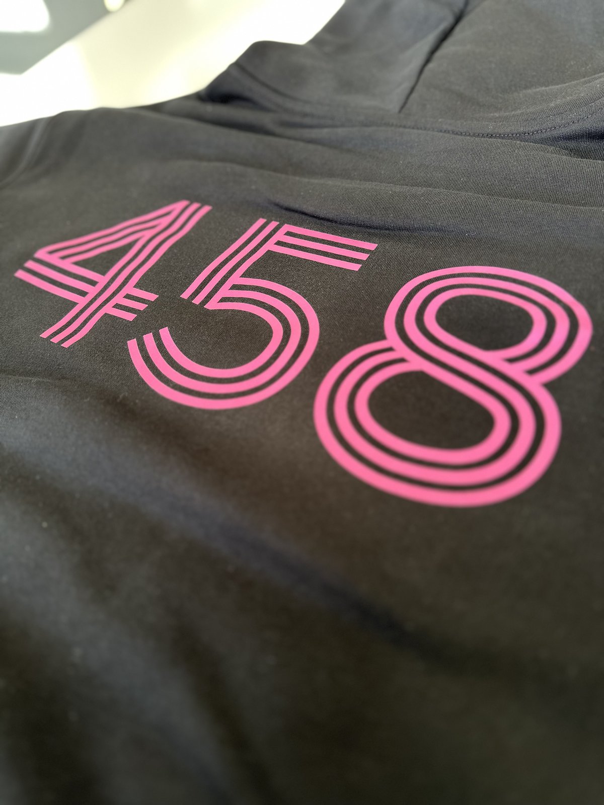 458 Pizzeria dtf print by Melbourne Merch - crisp print, moody lighting with good depth of field, professional close-up