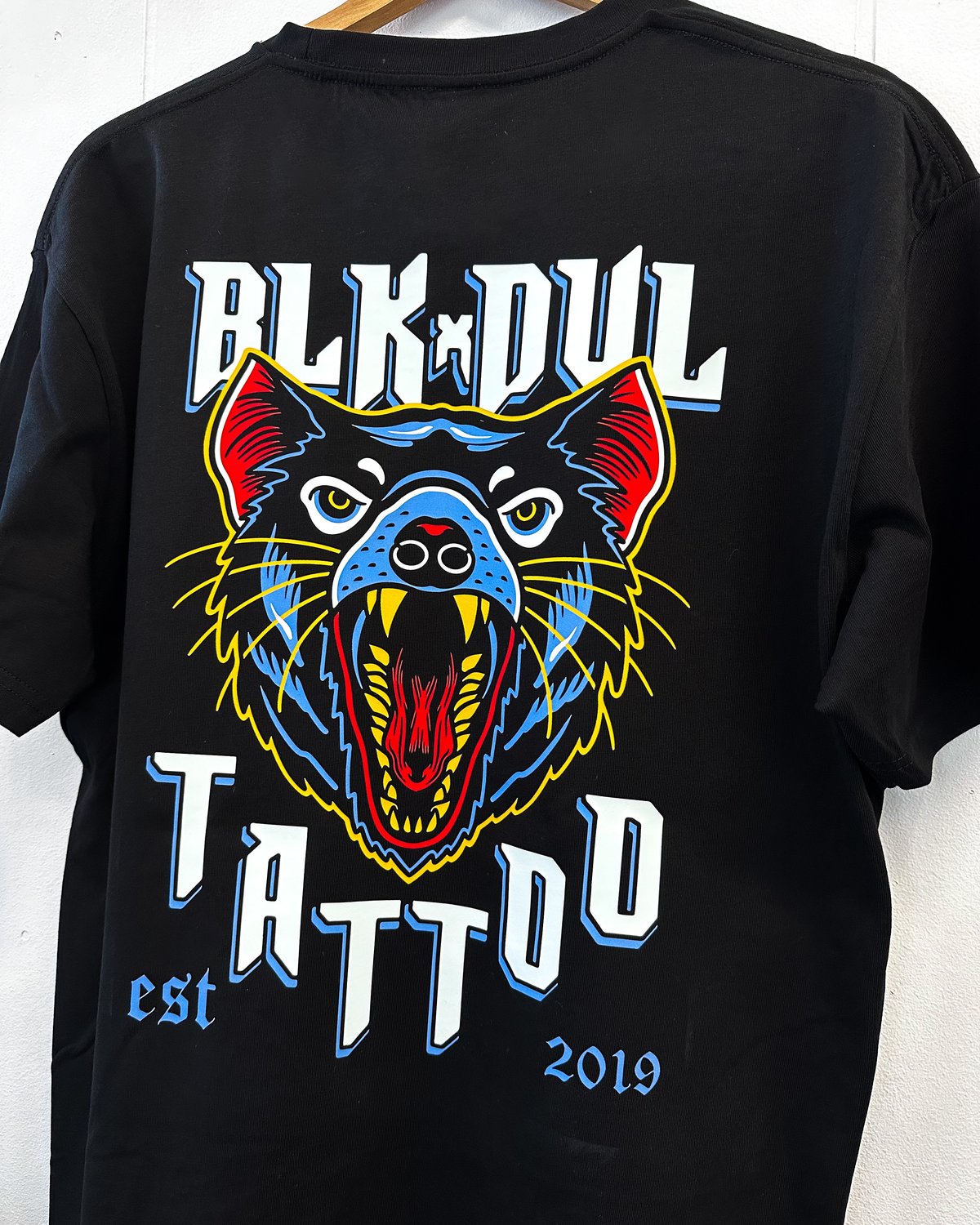 Black Devil Tattoo dtf print by Melbourne Merch - crisp colourful print, hung up providing real-world context, clean composition