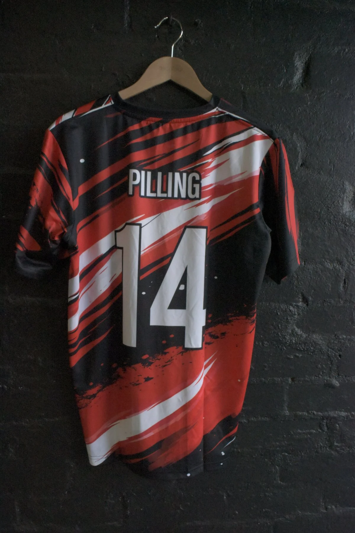 Pilling number 14 sublimated jersey back with red and black design