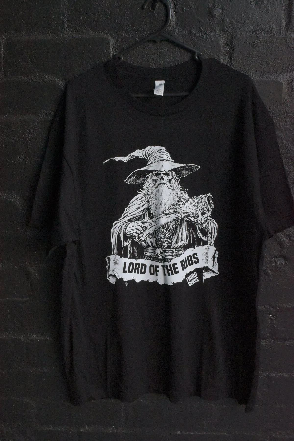 Third Wave Lord of the Ribs screen print tee on brick wall